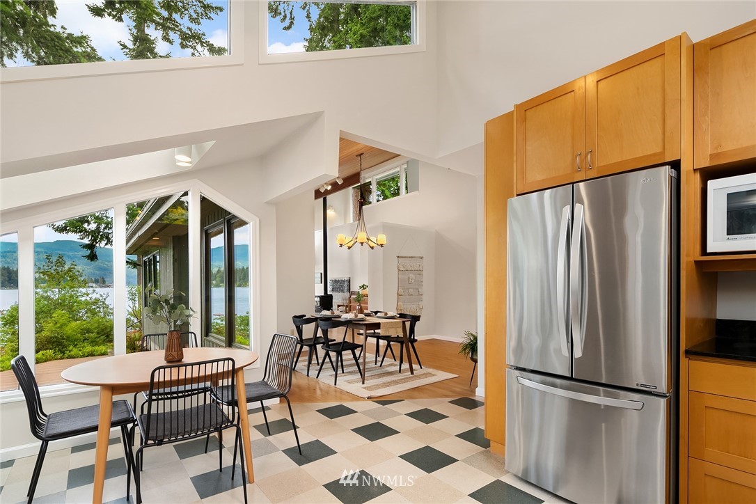 4730 Spring Street Bellingham, WA 98229 - Photo 11 of 30 a dining room with furniture water view and a floor to ceiling window