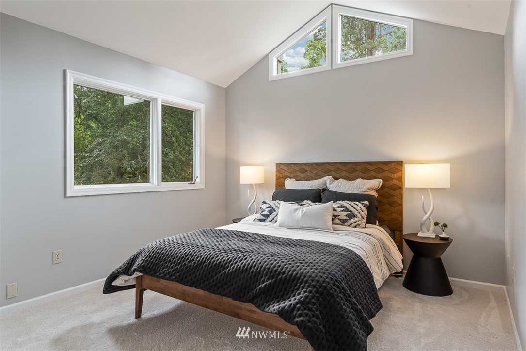 4730 Spring Street Bellingham, WA 98229 - Photo 21 of 30 a bedroom with a bed a lamp and a window