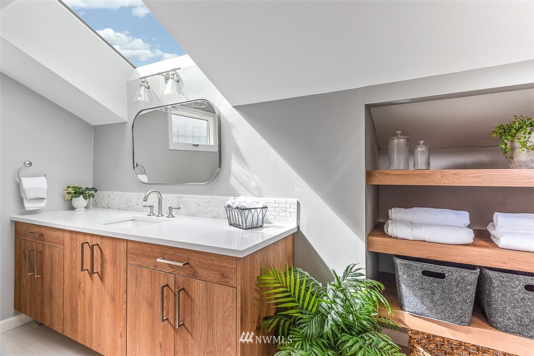4730 Spring Street Bellingham, WA 98229 - Photo 23 of 30 a bathroom with a sink and a mirror