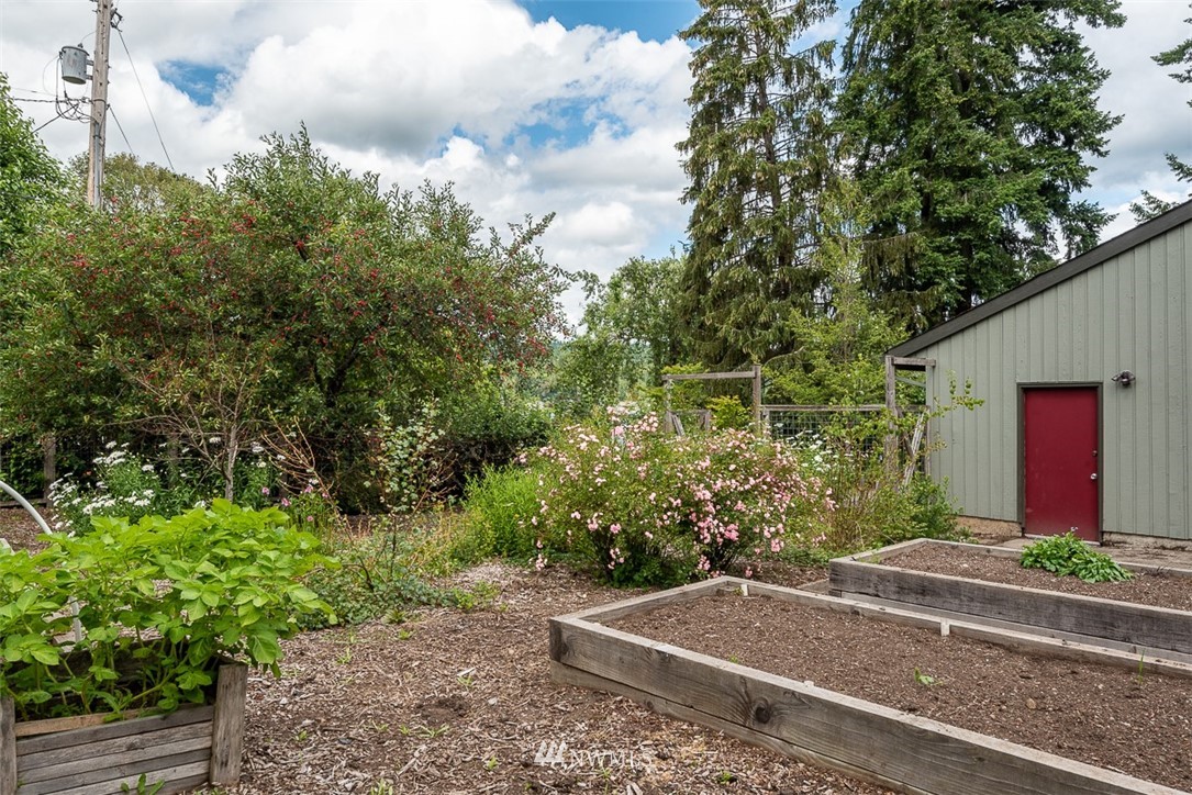 4730 Spring Street Bellingham, WA 98229 - Photo 27 of 30 a front view of a house with a yard and trees