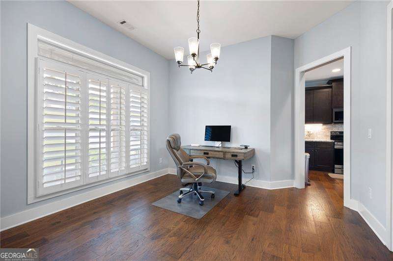 61 Roberson Drive White, GA 30184 - Photo 14 of 46 a view of a workspace with furniture and a window