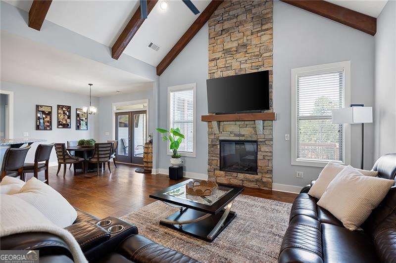 61 Roberson Drive White, GA 30184 - Photo 16 of 46 a living room with furniture a flat screen tv and a fireplace