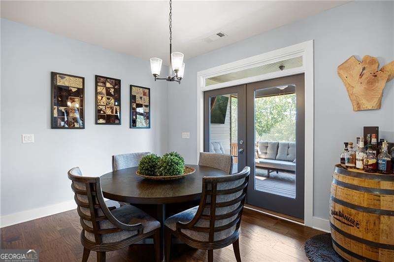 61 Roberson Drive White, GA 30184 - Photo 20 of 46 a view of a dining room with furniture window and wooden floor