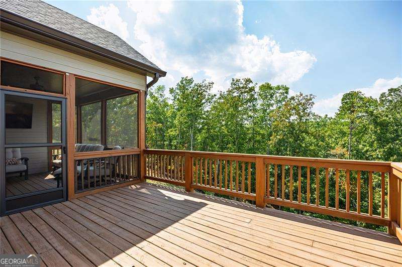 61 Roberson Drive White, GA 30184 - Photo 27 of 46 a balcony with wooden floor table and chairs