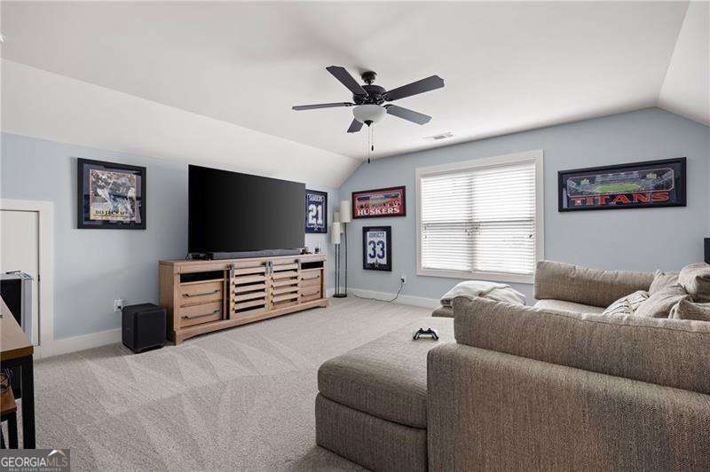 61 Roberson Drive White, GA 30184 - Photo 30 of 46 a living room with furniture and a flat screen tv