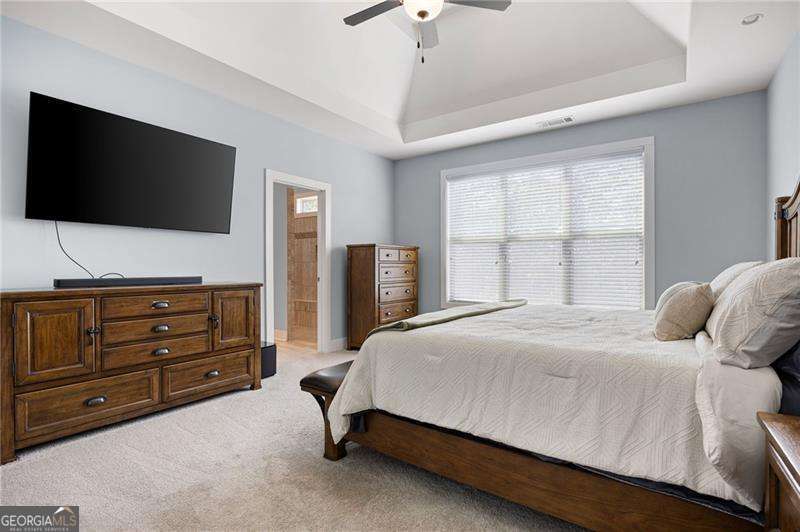 61 Roberson Drive White, GA 30184 - Photo 32 of 46 a bedroom with a bed and a flat screen tv
