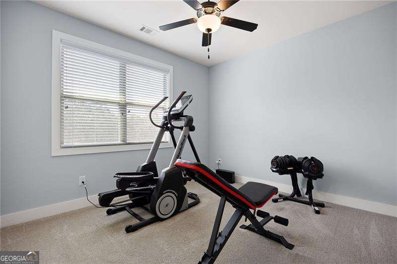 61 Roberson Drive White, GA 30184 - Photo 41 of 46 a room with gym equipment and windows