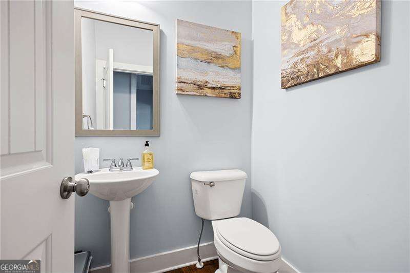 61 Roberson Drive White, GA 30184 - Photo 42 of 46 a bathroom with a toilet sink and mirror