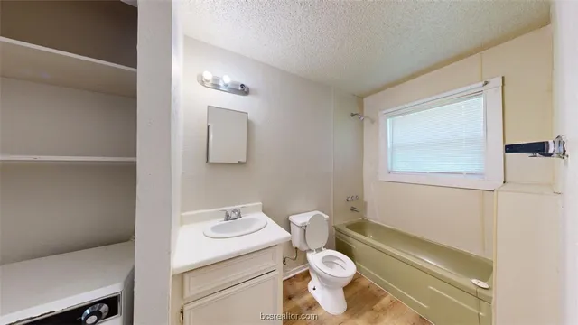 a bedroom with a bed and a chair