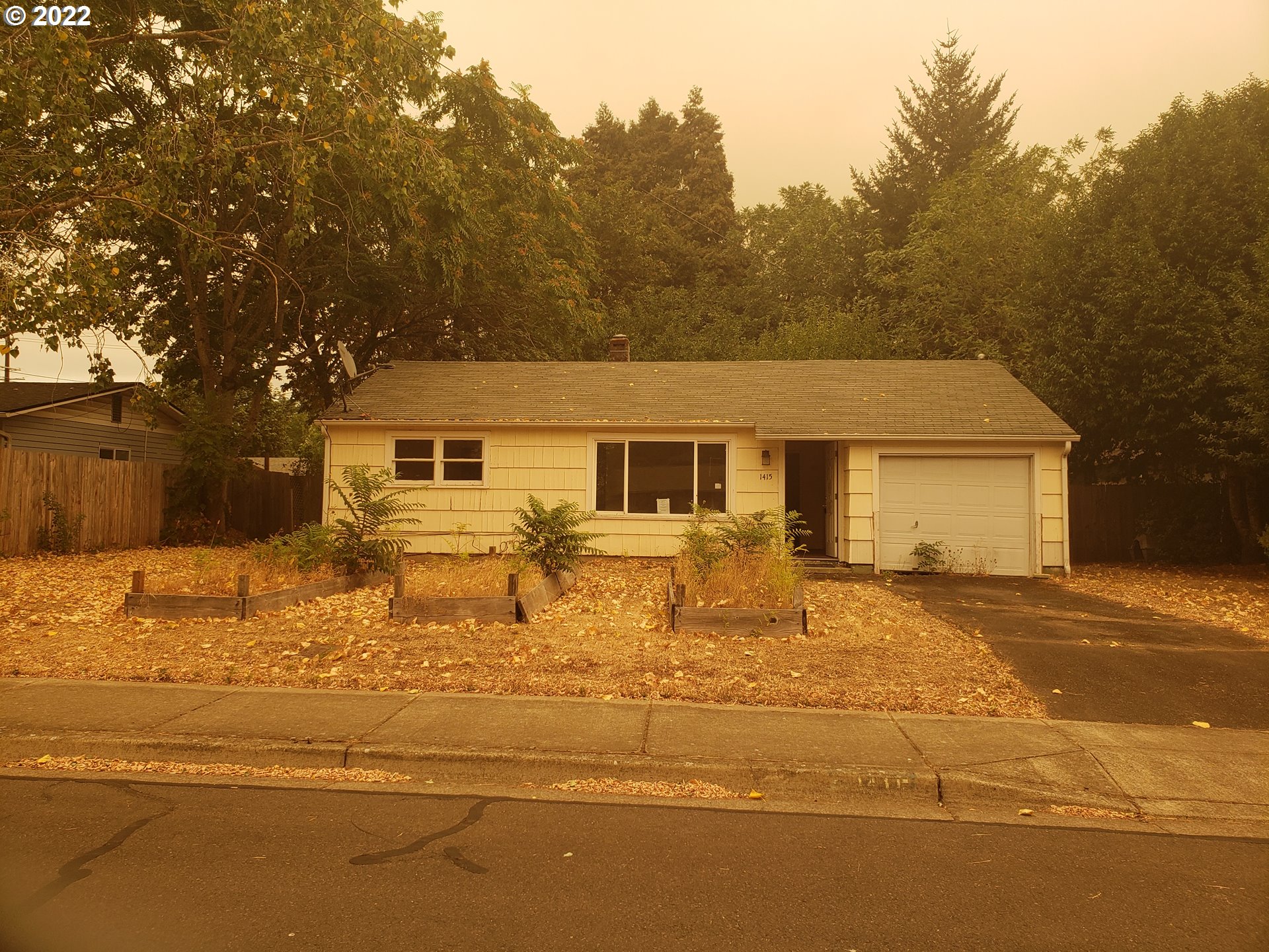 1415 Water Street Springfield, OR 97477 - Photo 1 of 5 a front view of a house with a yard