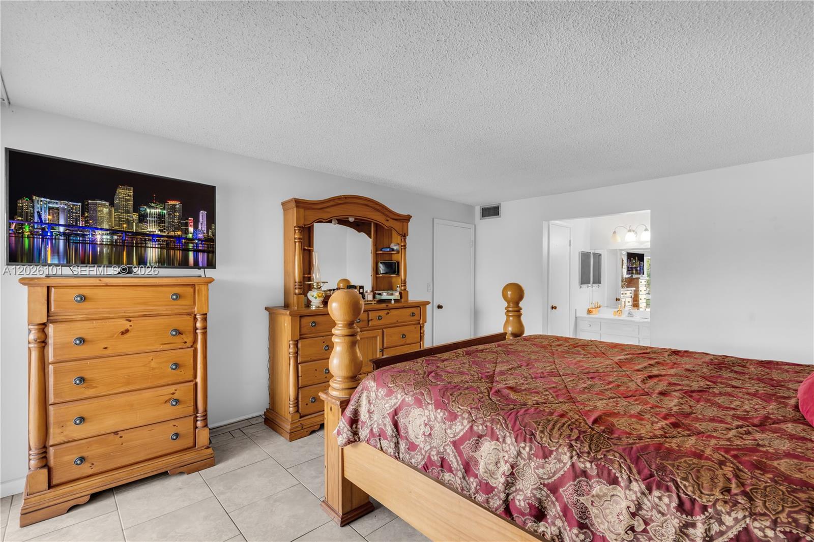 3551 Inverrary Drive, Unit 208 Lauderhill, FL 33319 - Photo 10 of 34 a bed room with a bed and a television