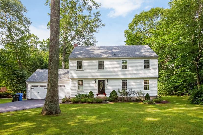 28 Partridge Lane Madison, CT 06443 - Photo 1 of 1 a front view of a house with a yard