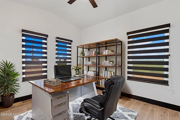 a view of a workspace with furniture