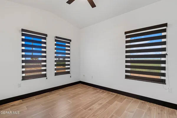a view of a room with stairs and wooden floor