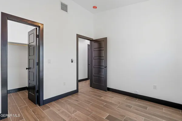 a view of a livingroom with wooden floor and closet