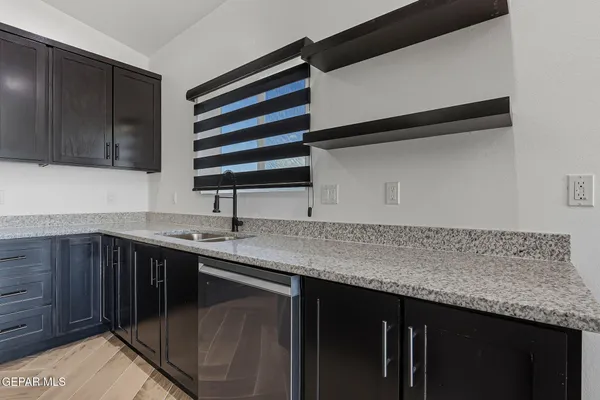 a kitchen with a sink and cabinets