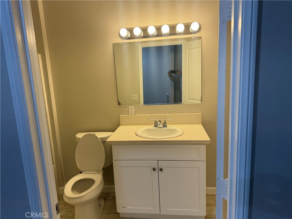 13665 Arrow Route, Unit 3 Fontana, CA 92335 - Photo 14 of 32 a bathroom with a sink and a mirror