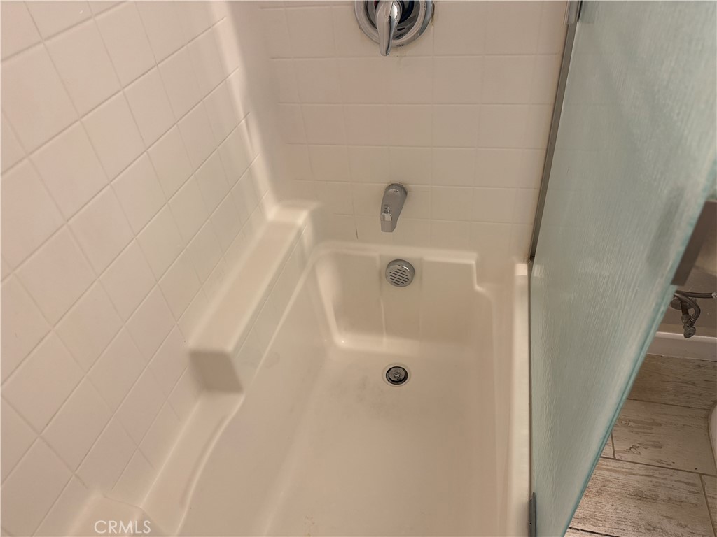 13665 Arrow Route, Unit 3 Fontana, CA 92335 - Photo 15 of 32 a bathroom with a tub