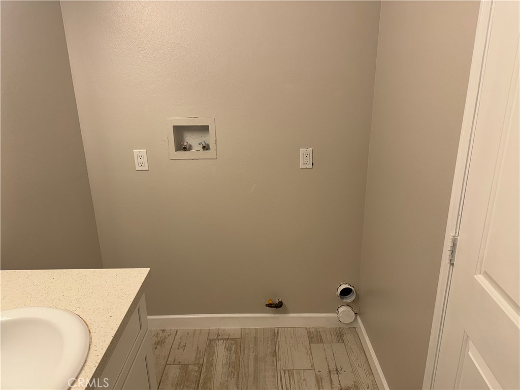 13665 Arrow Route, Unit 3 Fontana, CA 92335 - Photo 16 of 32 a bathroom with a sink and a toilet