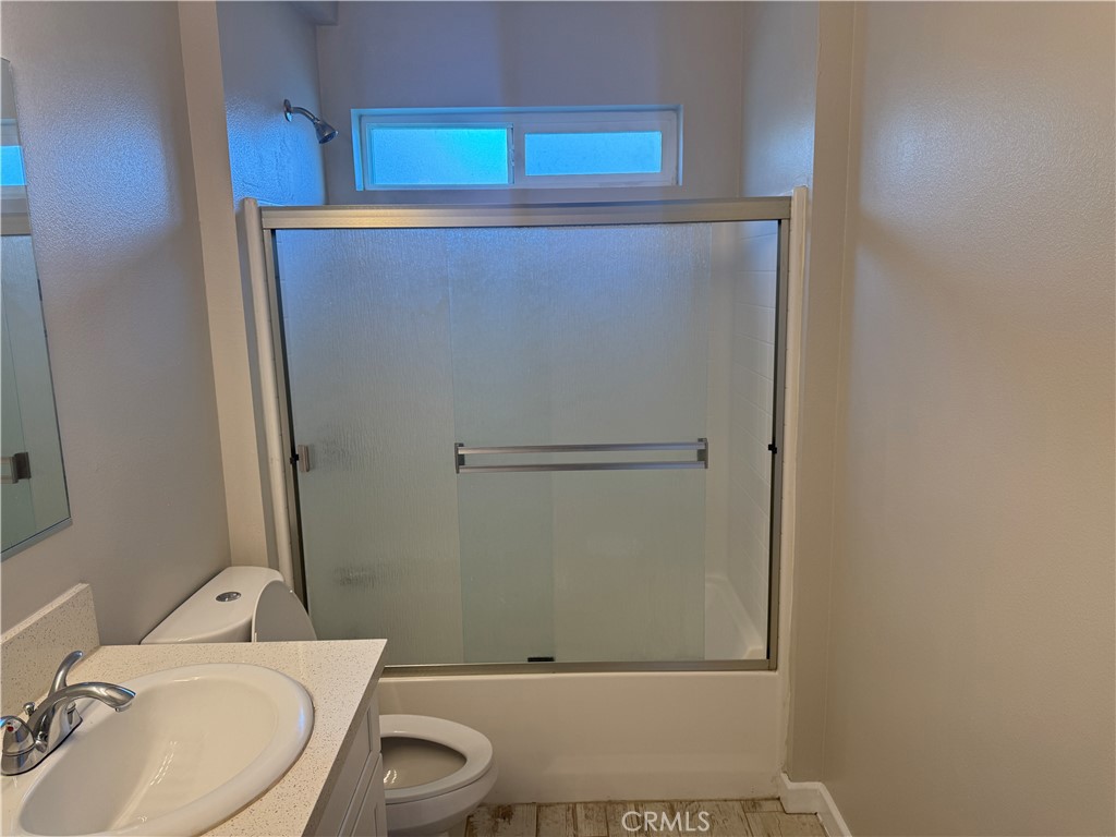 13665 Arrow Route, Unit 3 Fontana, CA 92335 - Photo 26 of 32 a bathroom with a toilet and a sink