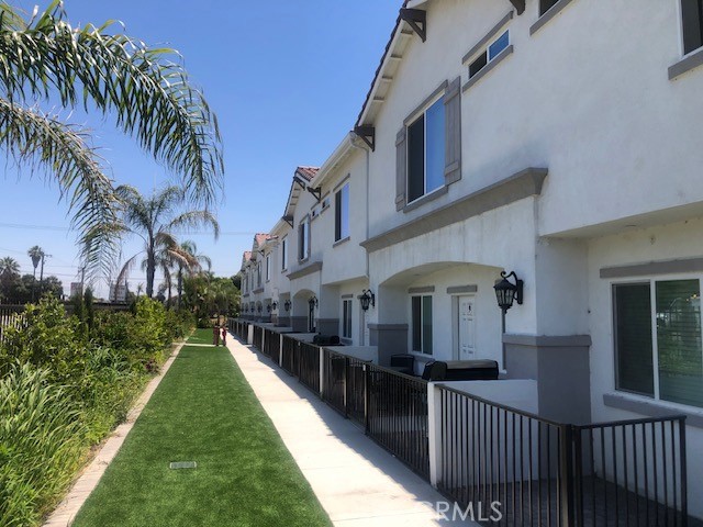 13665 Arrow Route, Unit 3 Fontana, CA 92335 - Photo 30 of 32 a view of a house with a yard