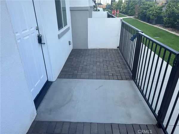 a kitchen with a sink cabinets and wooden floor