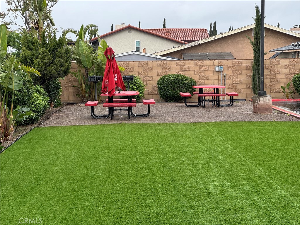 13665 Arrow Route, Unit 3 Fontana, CA 92335 - Photo 32 of 32 a childrens park with lots of swings and slides