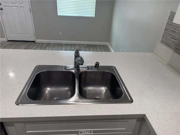 a white toilet sitting next to a bathroom sink