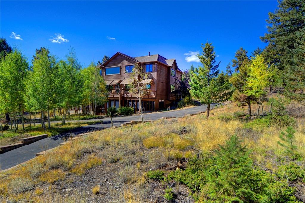 78 Double Tree Road Bailey, CO 80421 - Photo 3 of 34 a swimming pool with outdoor seating and yard