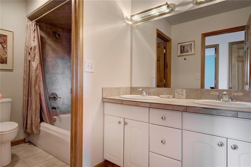 78 Double Tree Road Bailey, CO 80421 - Photo 23 of 34 a bathroom with a granite countertop sink toilet and shower
