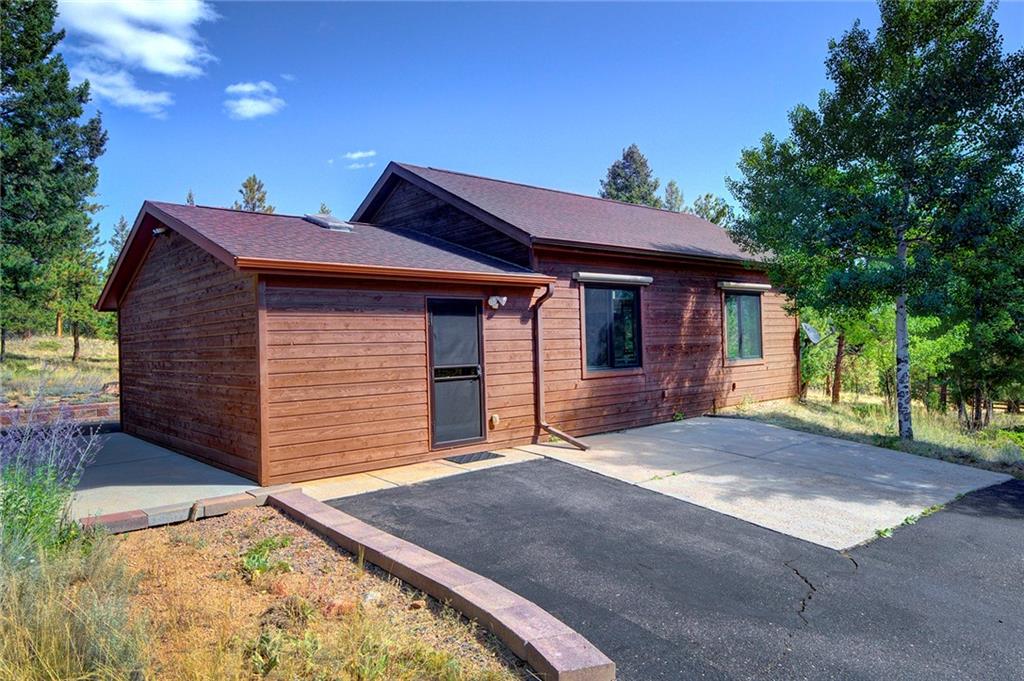 78 Double Tree Road Bailey, CO 80421 - Photo 30 of 34 a view of a house with a yard