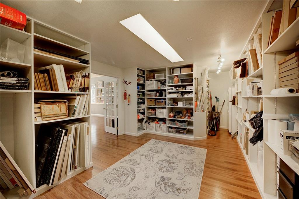 78 Double Tree Road Bailey, CO 80421 - Photo 33 of 34 a view of a living room with furniture and wooden floor