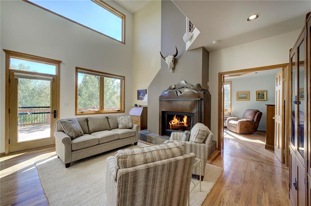 78 Double Tree Road Bailey, CO 80421 - Photo 9 of 34 a living room with furniture and a fireplace