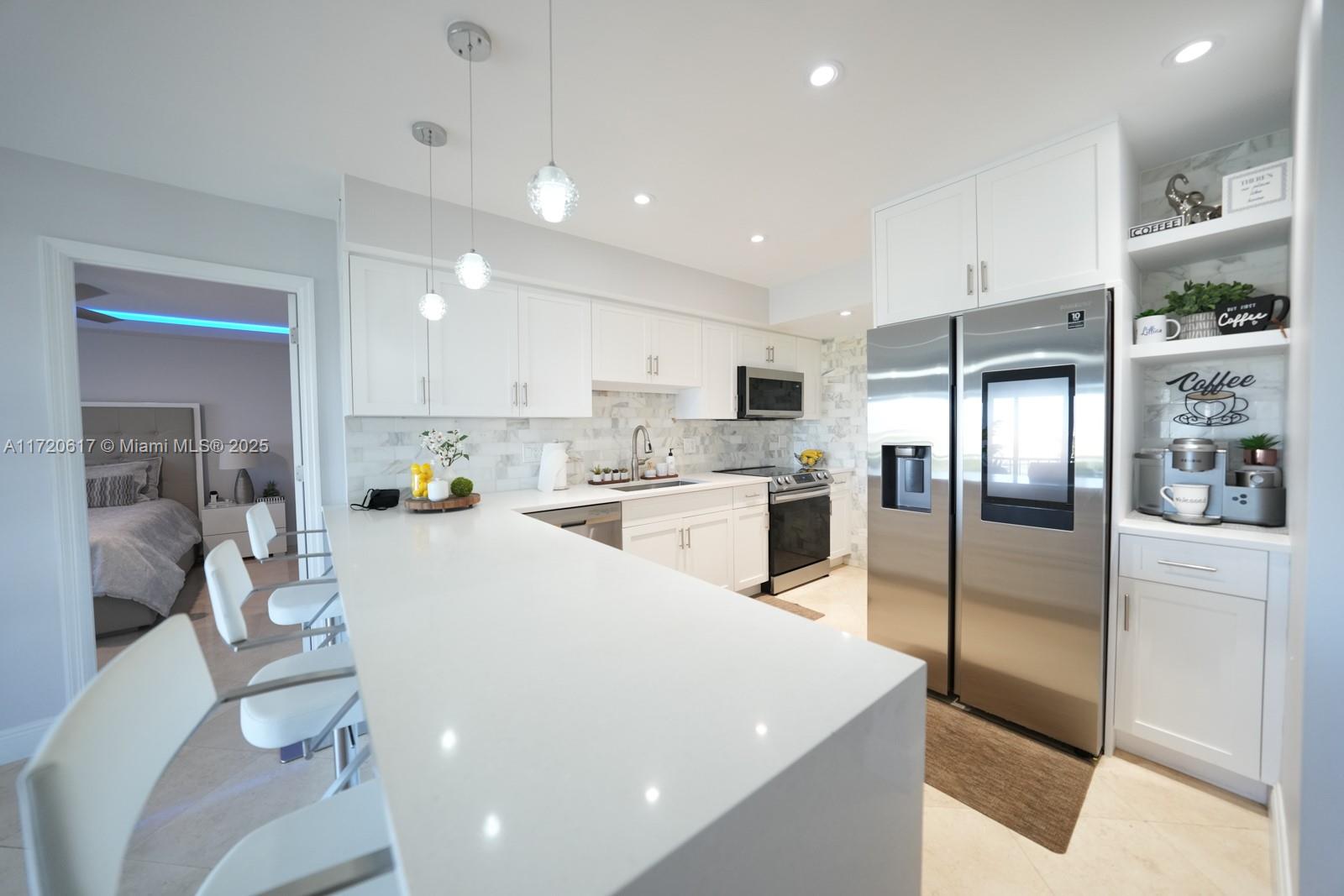 a kitchen with refrigerator and cabinets