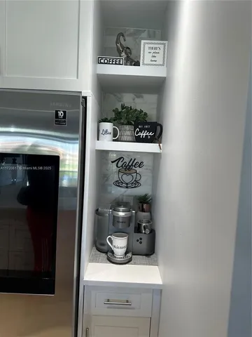 a kitchen with kitchen island a counter top space a sink and appliances