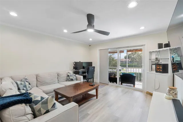 a view of a balcony with chair and floor to ceiling window