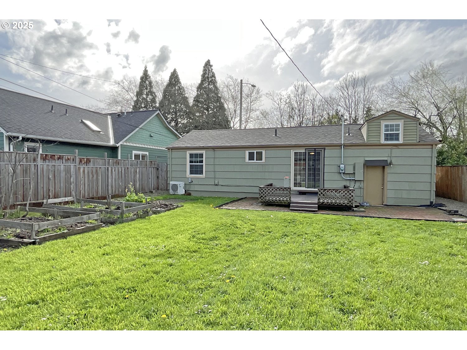2775 Hilyard Street Eugene, OR 97405 - Photo 22 of 27 a view of a house with backyard and a garden