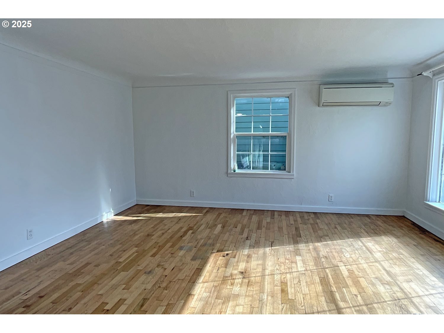 2775 Hilyard Street Eugene, OR 97405 - Photo 3 of 27 a view of an empty room with a window