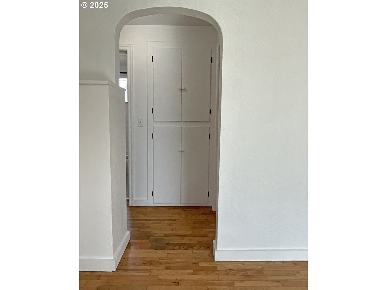 2775 Hilyard Street Eugene, OR 97405 - Photo 7 of 27 a view of a hallway with wooden floor