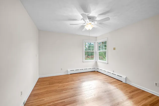 a view of a livingroom with wooden floor