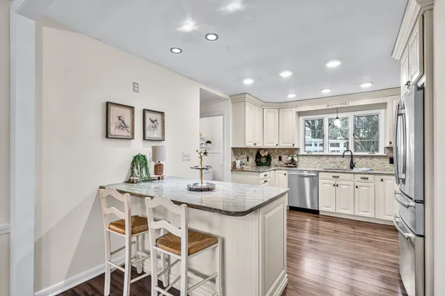 a kitchen with granite countertop white cabinets and counter space