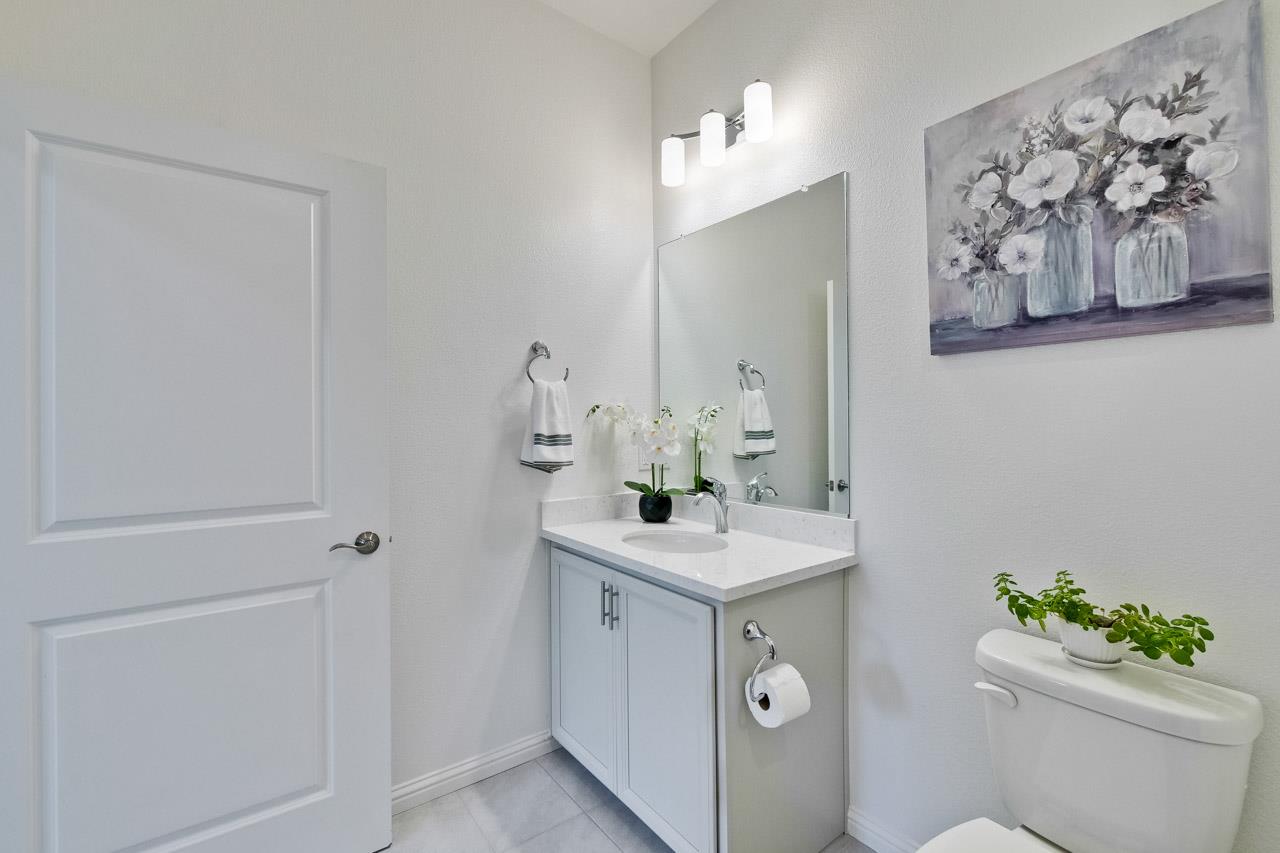 6656 Stealth Loop San Jose, CA 95119 - Photo 11 of 50 a bathroom with a sink mirror vanity and toilet