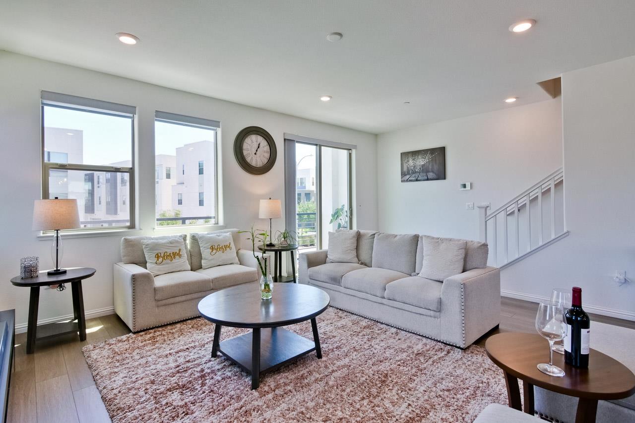 6656 Stealth Loop San Jose, CA 95119 - Photo 13 of 50 a living room with furniture potted plant and a large window