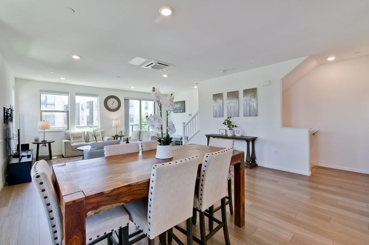 6656 Stealth Loop San Jose, CA 95119 - Photo 18 of 50 a view of a dining room with furniture and wooden floor