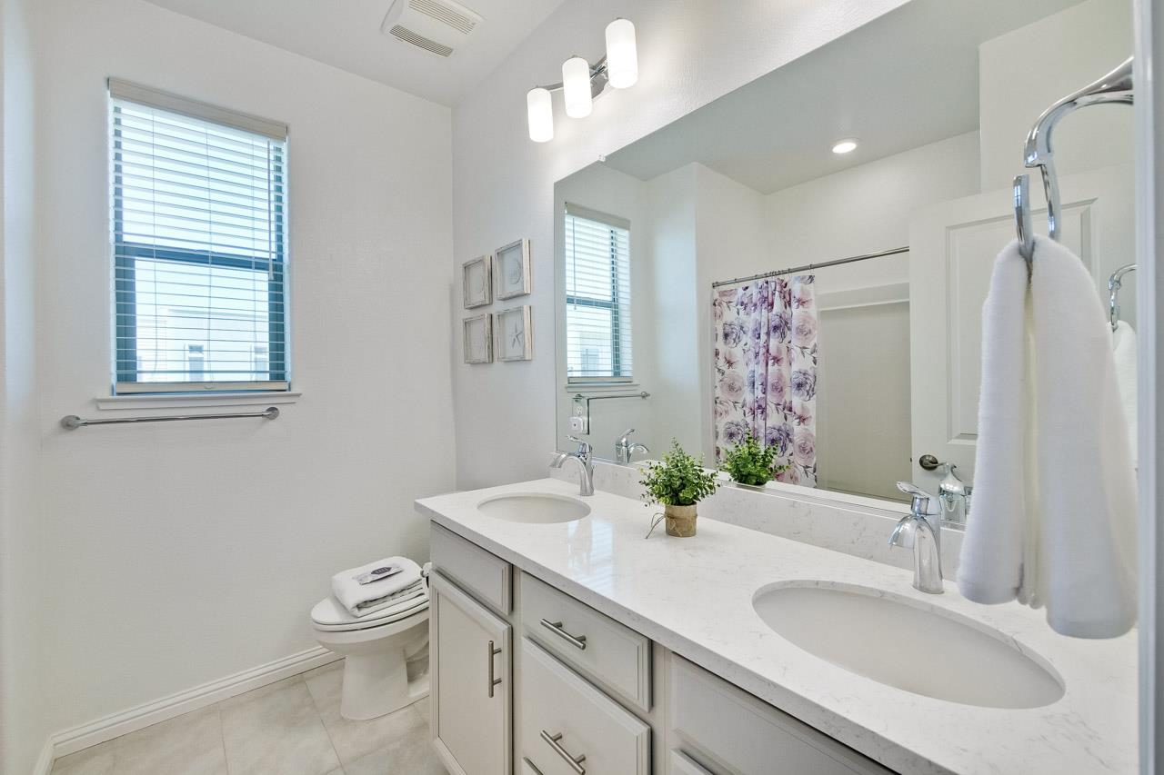 6656 Stealth Loop San Jose, CA 95119 - Photo 30 of 50 a bathroom with a sink toilet and shower