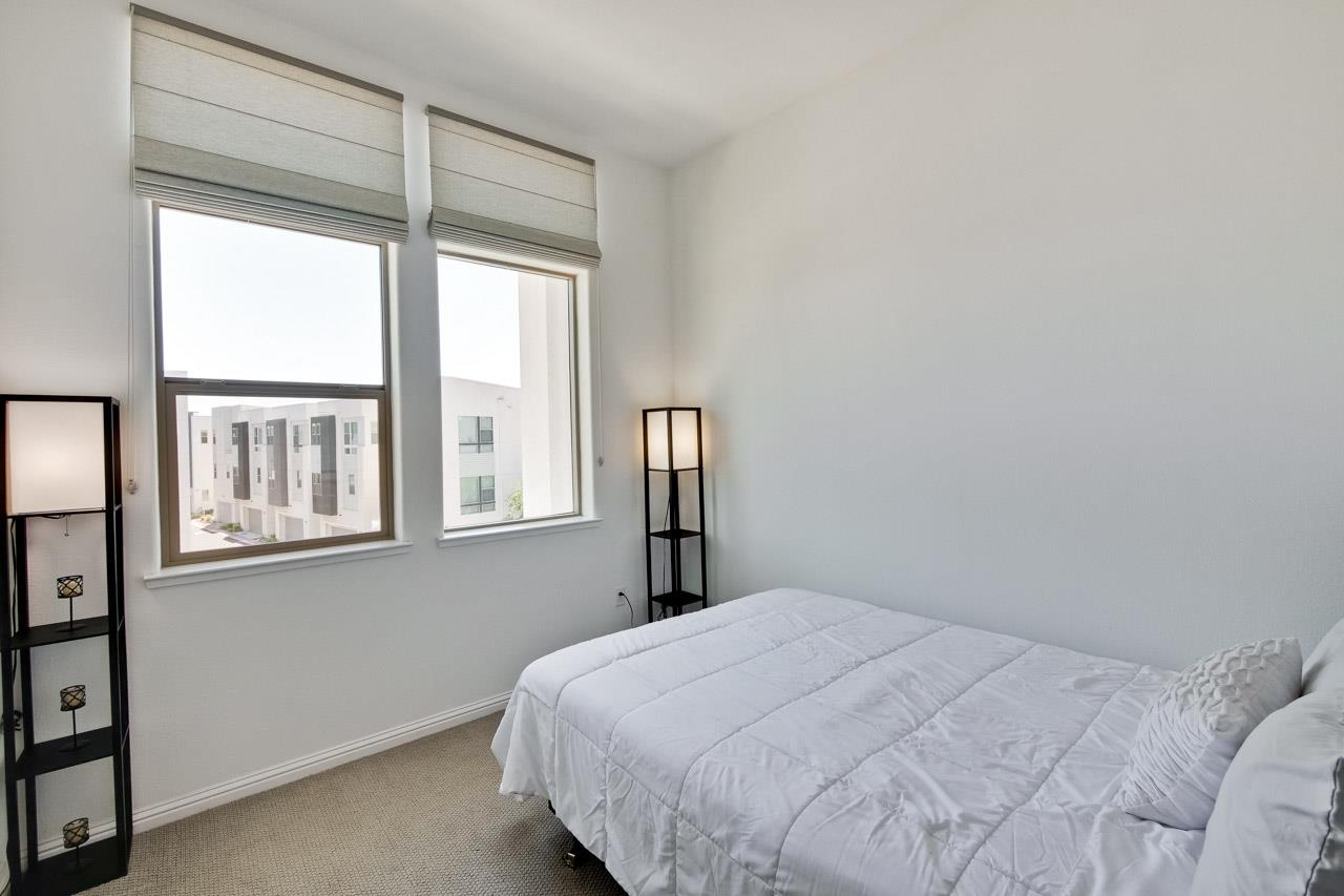 6656 Stealth Loop San Jose, CA 95119 - Photo 33 of 50 a bedroom with a bed and a window