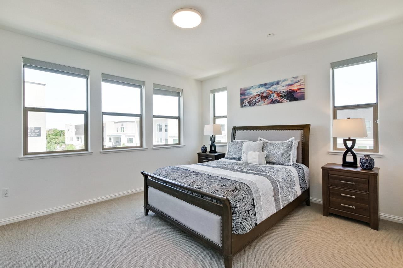 6656 Stealth Loop San Jose, CA 95119 - Photo 35 of 50 a bedroom with a bed and a window