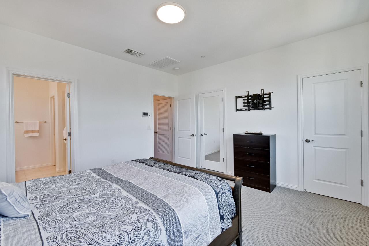 6656 Stealth Loop San Jose, CA 95119 - Photo 37 of 50 a bedroom with a bed and a dresser