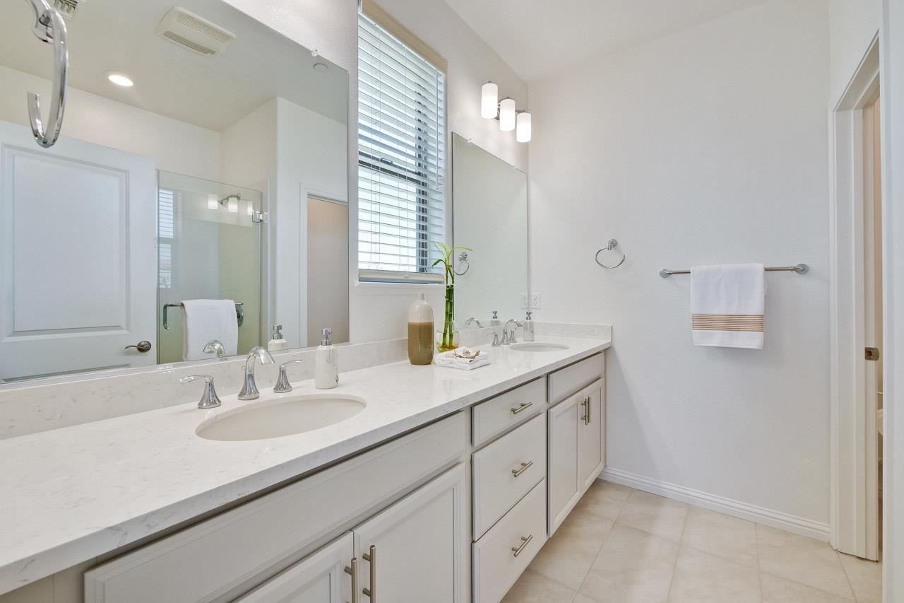 6656 Stealth Loop San Jose, CA 95119 - Photo 39 of 50 a bathroom with a sink double vanity and a mirror