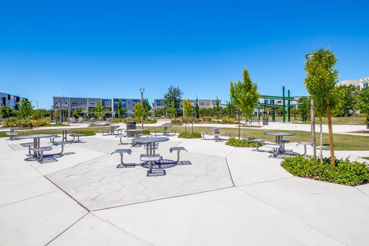 6656 Stealth Loop San Jose, CA 95119 - Photo 46 of 50 a view of a swimming pool with a lawn chairs and plants